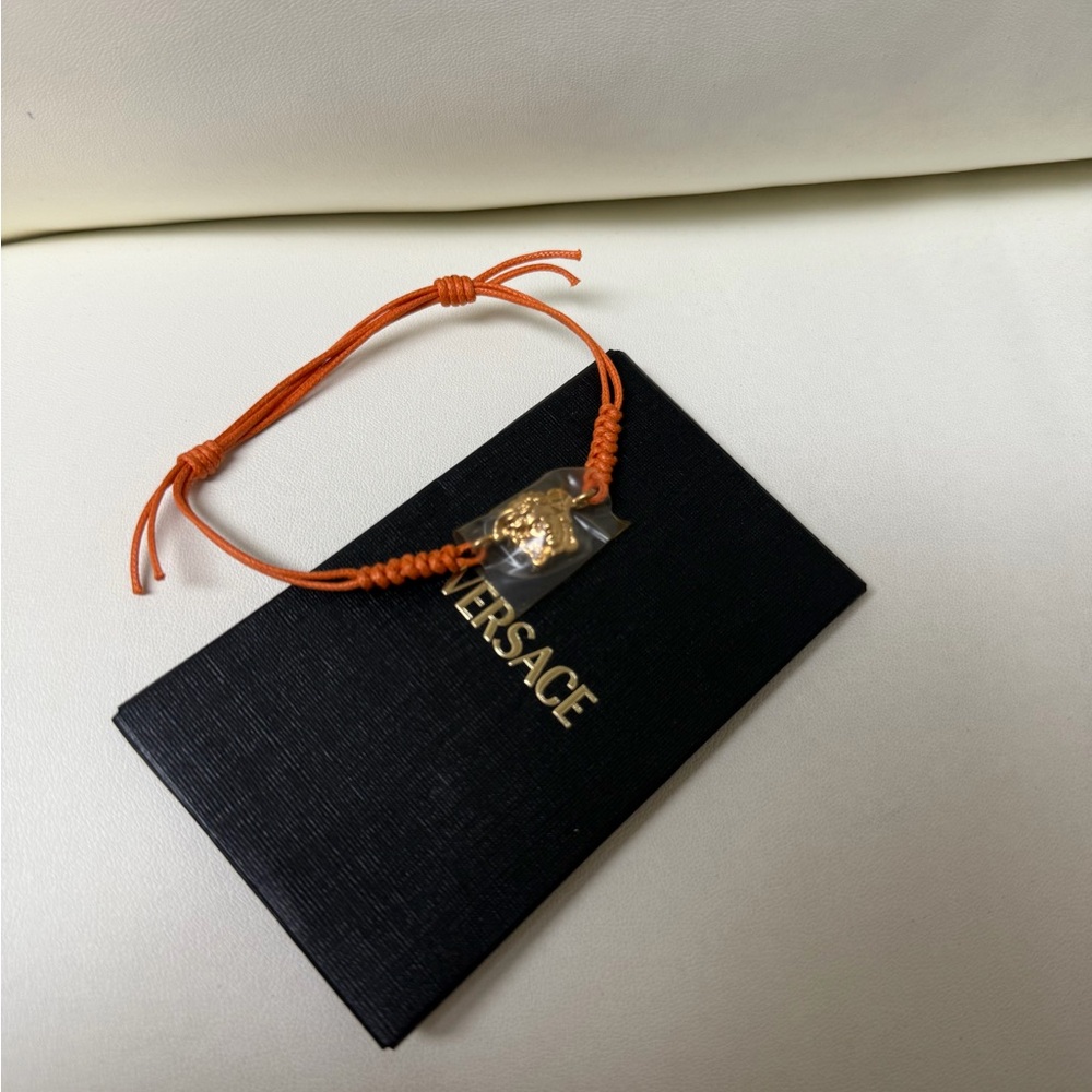 ❌SOLD Versace Orange Cord Bracelet with Gold Medusa